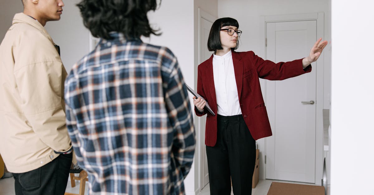 Real estate agent showing a property to clients